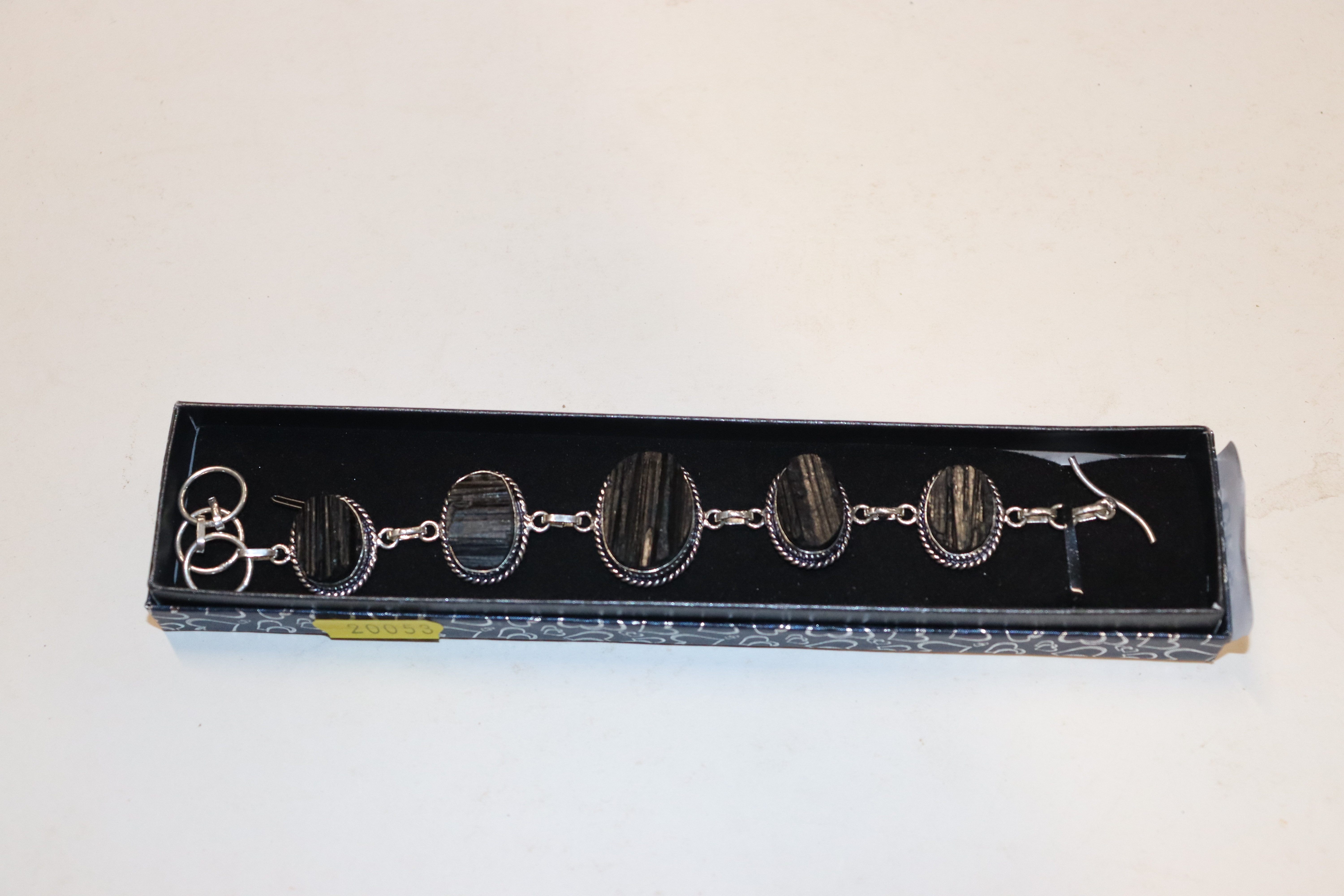 A boxed cut jet and silver bracelet marked 925 on