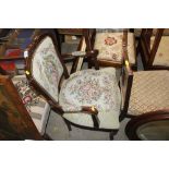 A mahogany French style elbow chair with tapestry