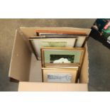 A box of various pictures and prints