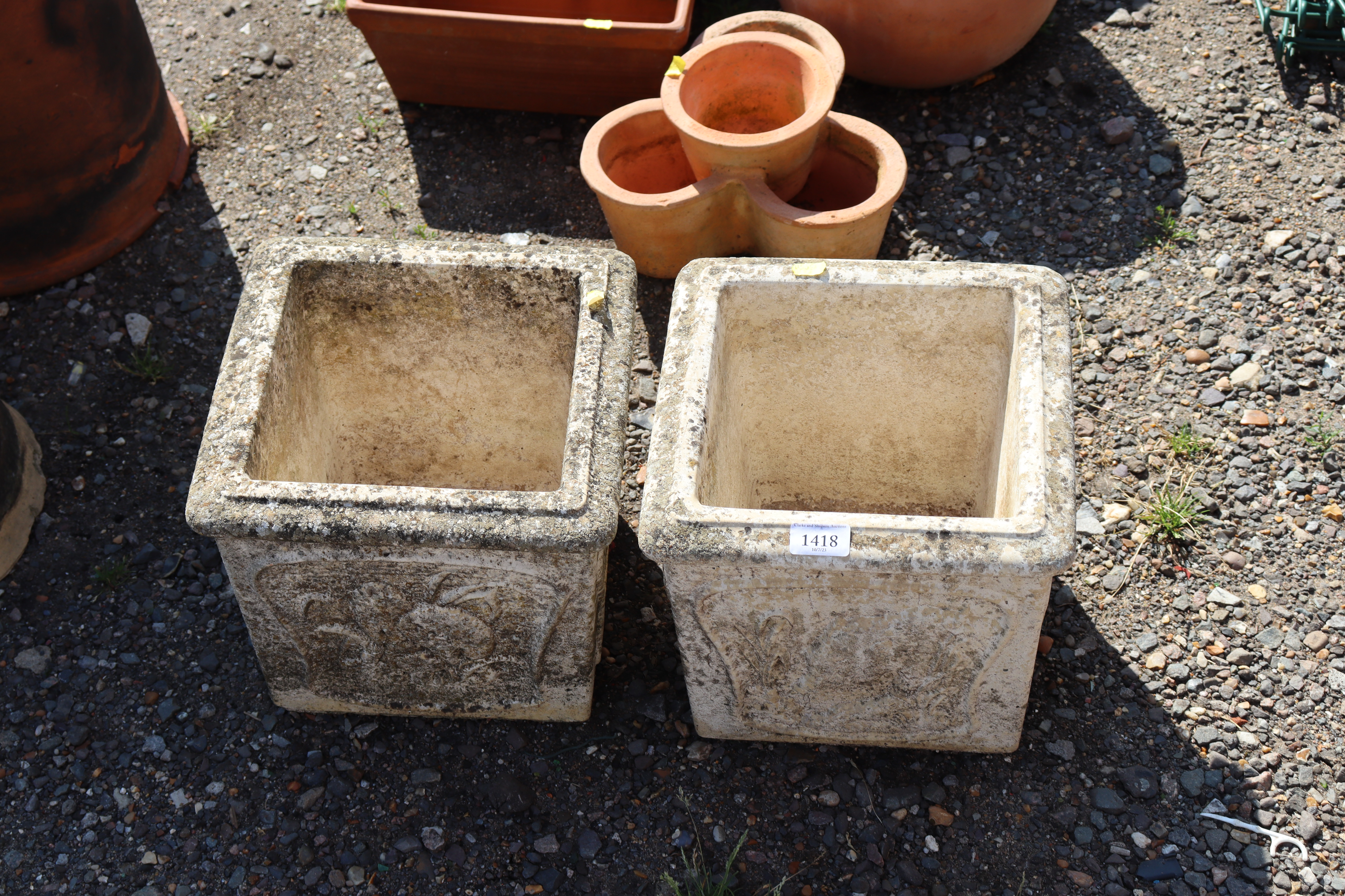 Two square concrete planters