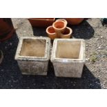 Two square concrete planters