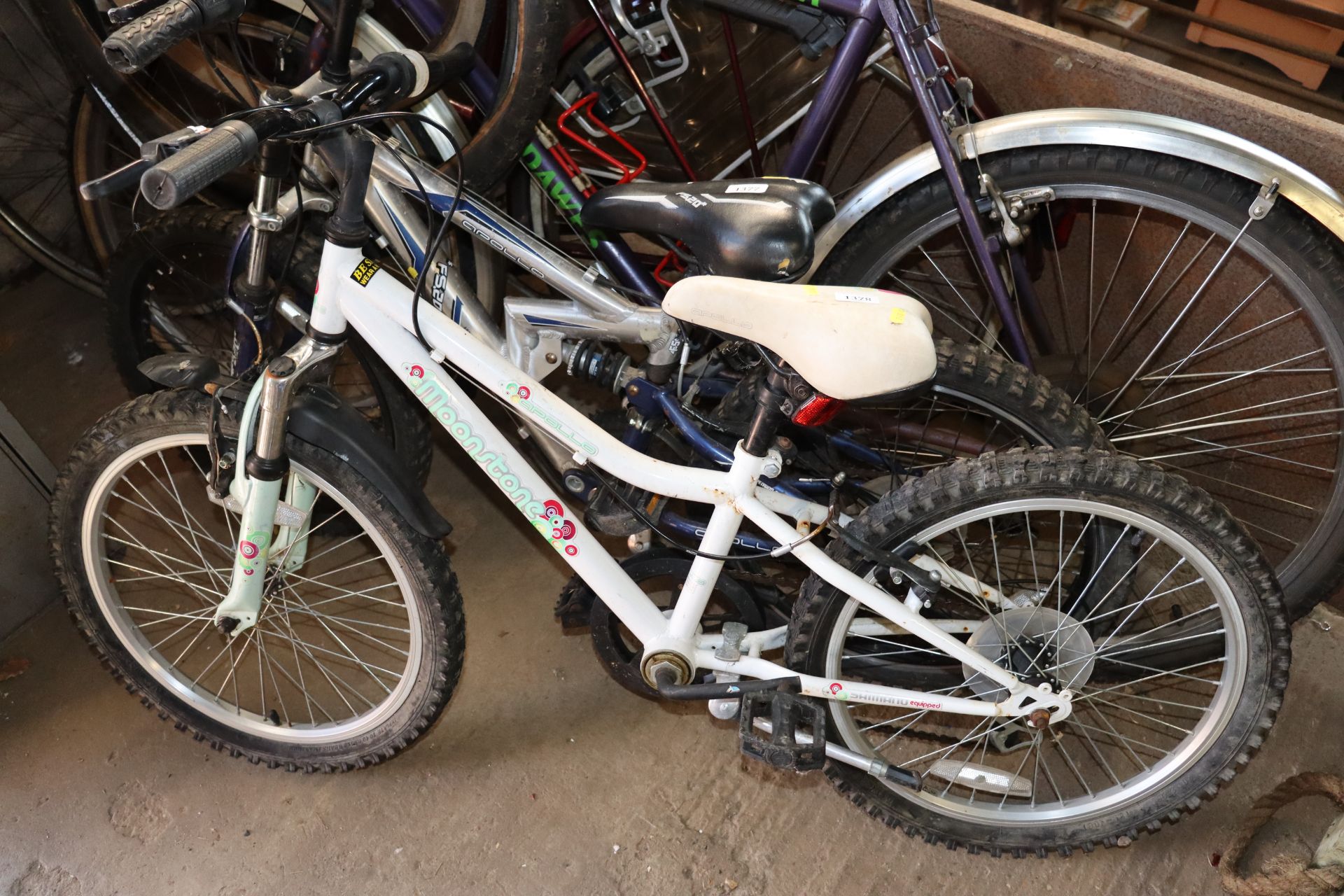 A child's Apollo Moonstone mountain bike with fron