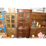 A leaded glazed corner cabinet