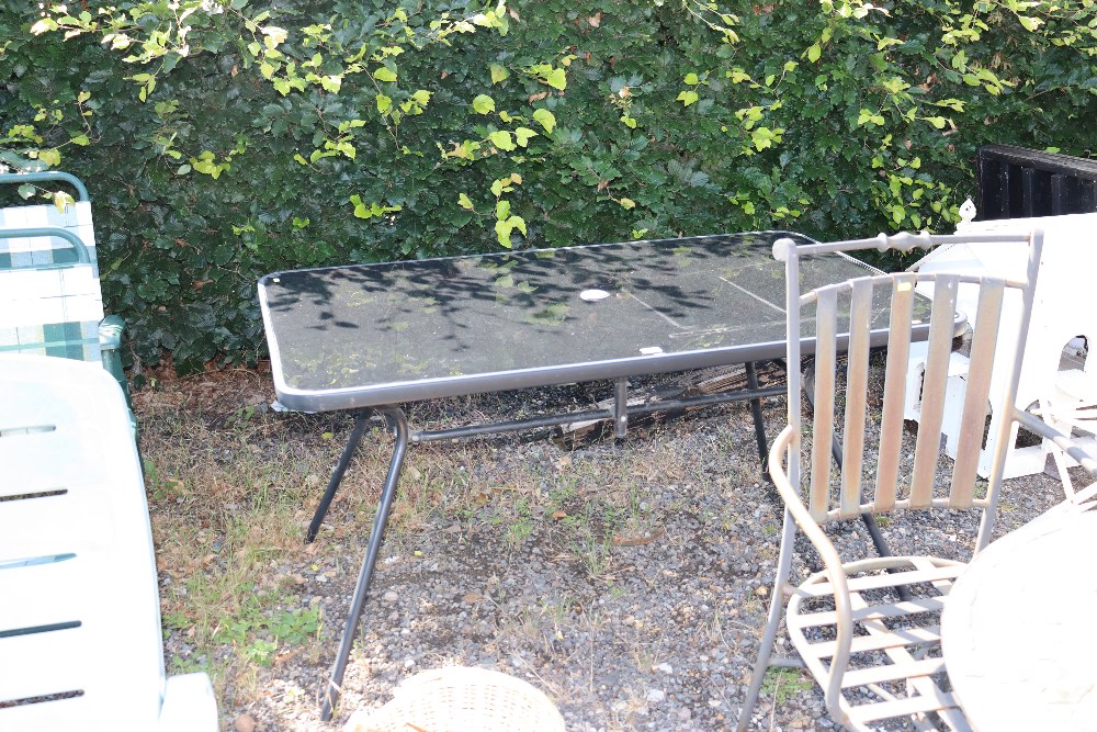 A glass topped garden table