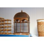 A wooden and metal bird cage