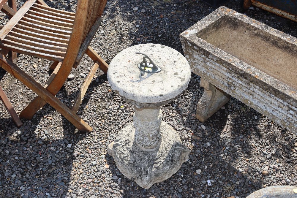A concrete sundial on stand