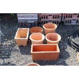 A quantity of various terracotta planters