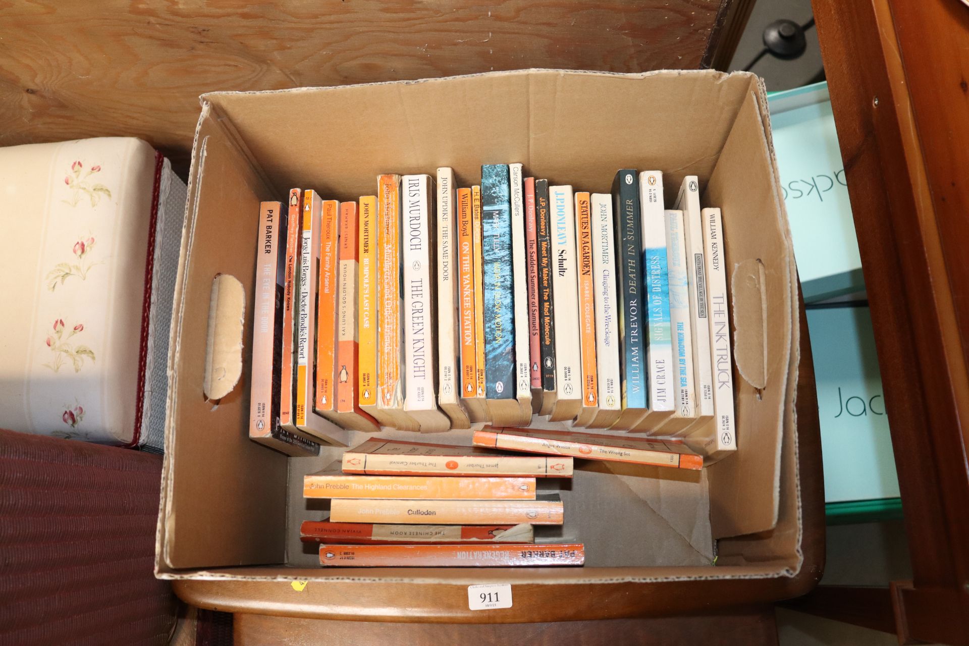 A box of various Penguin books