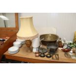 A pair of brass candlesticks, a port hole, two table lamps and shade