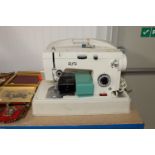 An Alpha sewing machine in fitted case (sold as co