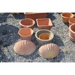 A quantity of various terracotta planters