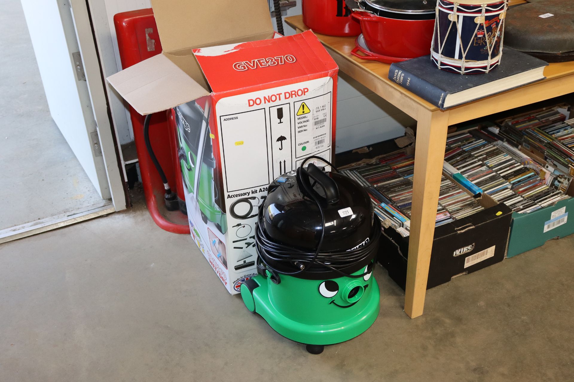 A George pneumatic vacuum cleaner with original bo