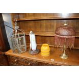 A table lamp with glass shade lacking lead, a part glazed table lamp and hanging candle lantern