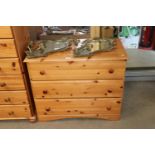 A modern pine chest, fitted three drawers