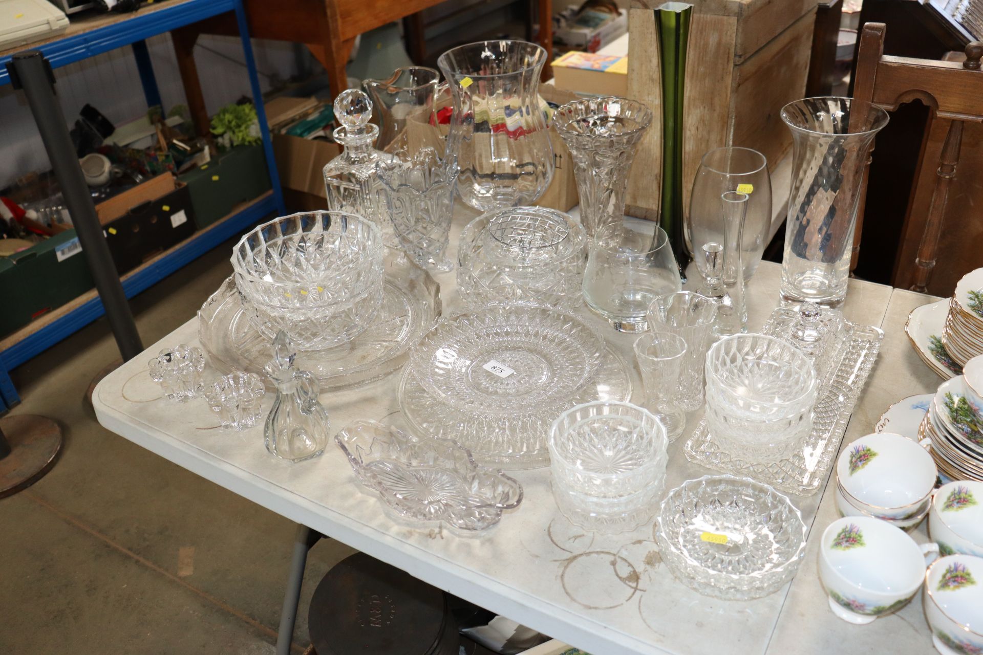 A collection of various cut and uncut glassware