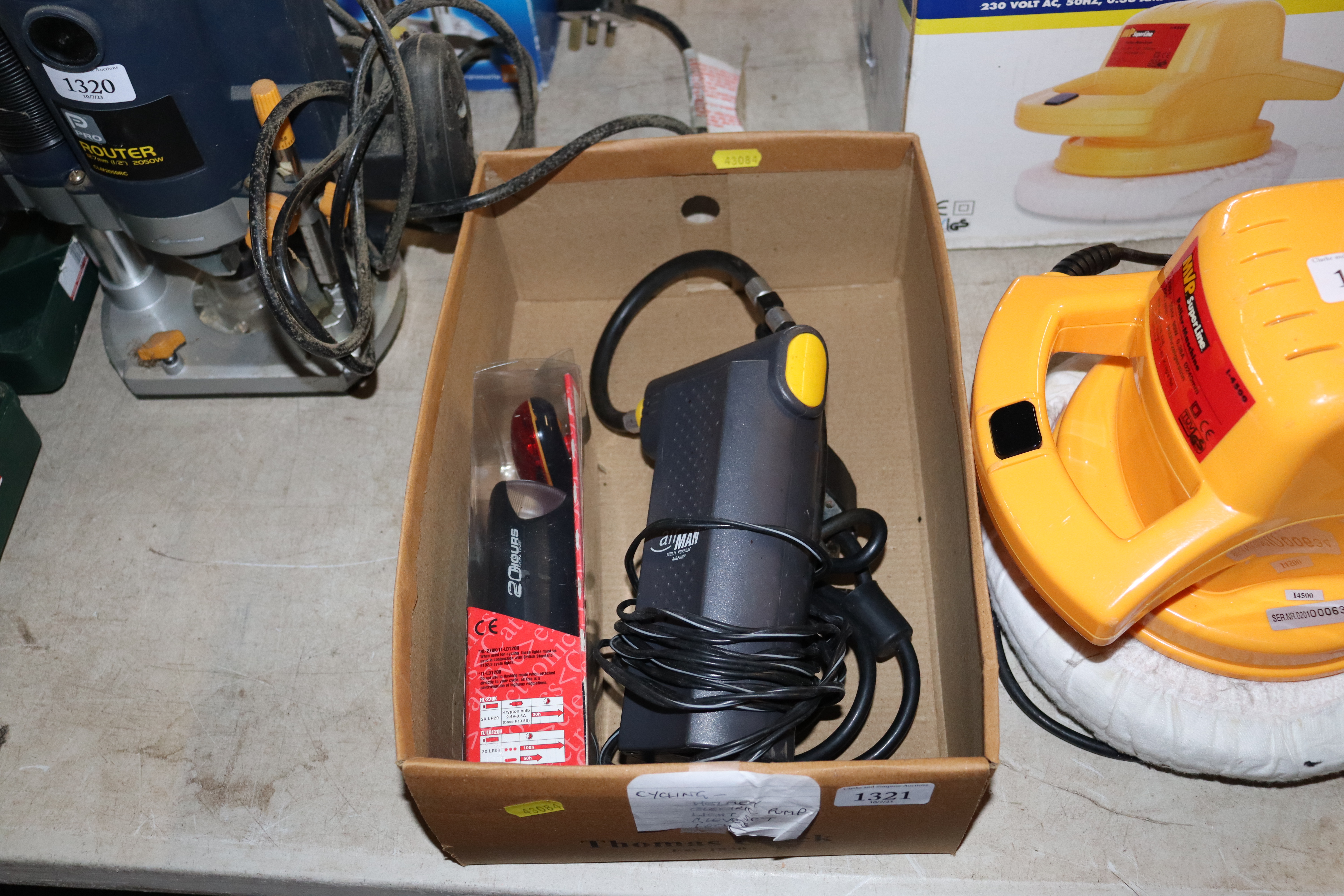 An AIRMAN 12v multi purpose air pump with a bicycl