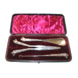 An Adie & Lovekin, Birmingham cased silver beast head decorated shoe horn, glove stretcher, and butt