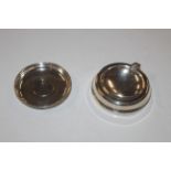 A white metal coin dish and a silver ash tray with