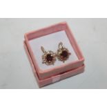 A pair of 9ct gold garnet screw back ear-rings, ap