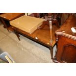 A mahogany coffee table and a circular topped side