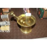 A brass pestle and mortar
