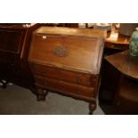 An oak bureau fitted two drawers