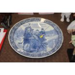 A Boch Delft charger depicting a rural scene