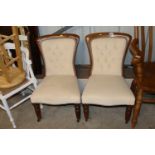 A pair of mahogany framed nursing chairs with butt