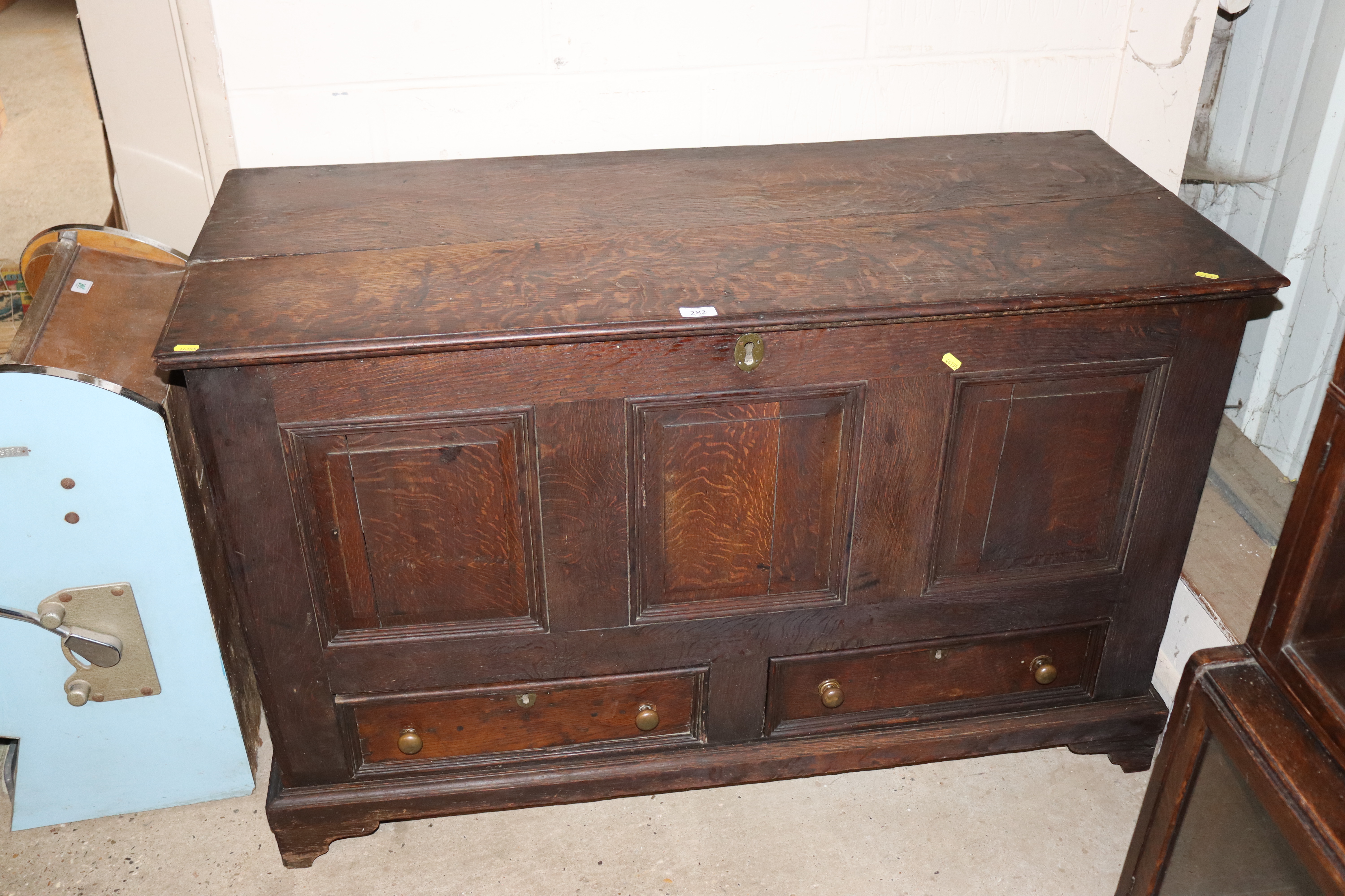 An oak fielded panelled mule chest