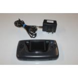 A Sega Game Gear portable games system with power