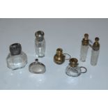Seven various silver topped and other scent bottle