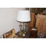 A brass and glass Waterford table lamp and shade