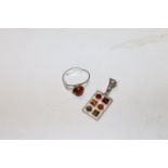 A Sterling silver and amber set adjustable ring wi