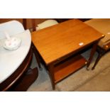 A teak fold over tea trolley