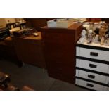 A teak effect six drawer chest