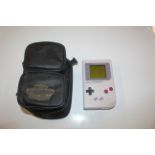 A Nintendo GameBoy with various accessories and ga