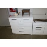 A modern white bedroom chest fitted two short over