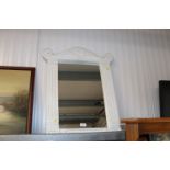 A white framed wall mirror