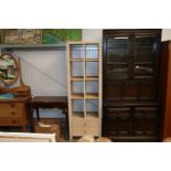 A contemporary limed oak effect shelf unit