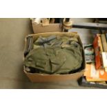 A box of mixed military items