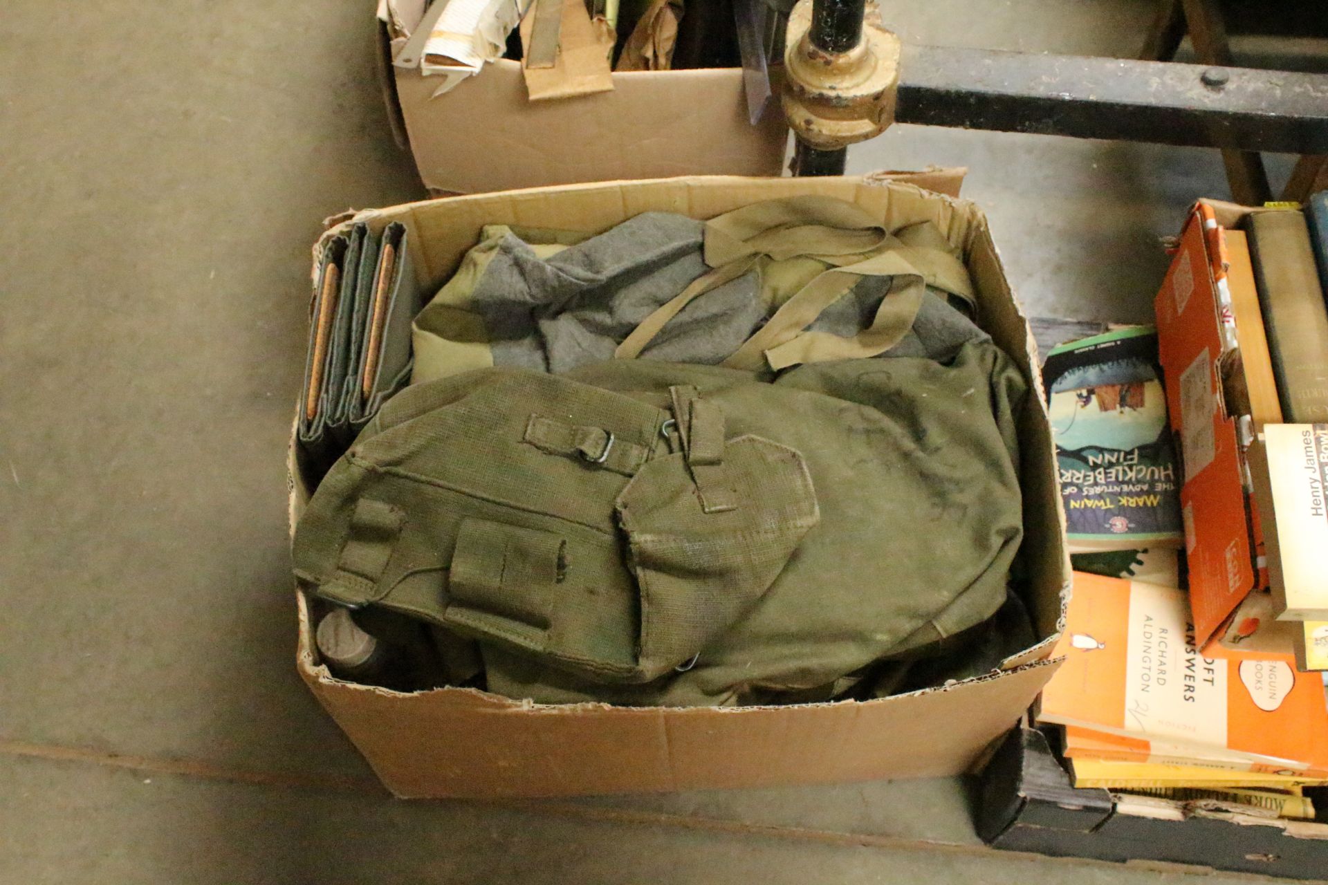 A box of mixed military items