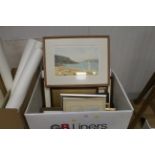 A box of various pictures and prints