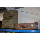 A vintage leather suitcase and a Destinations suit