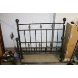 A wrought iron double bed frame