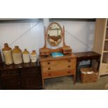 An Edwardian dressing chest fitted three drawers