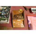 A wooden box and contents of various coinage