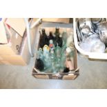 A box of old glass and stoneware bottles