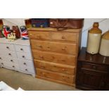 A modern pine chest fitted two short over four lon