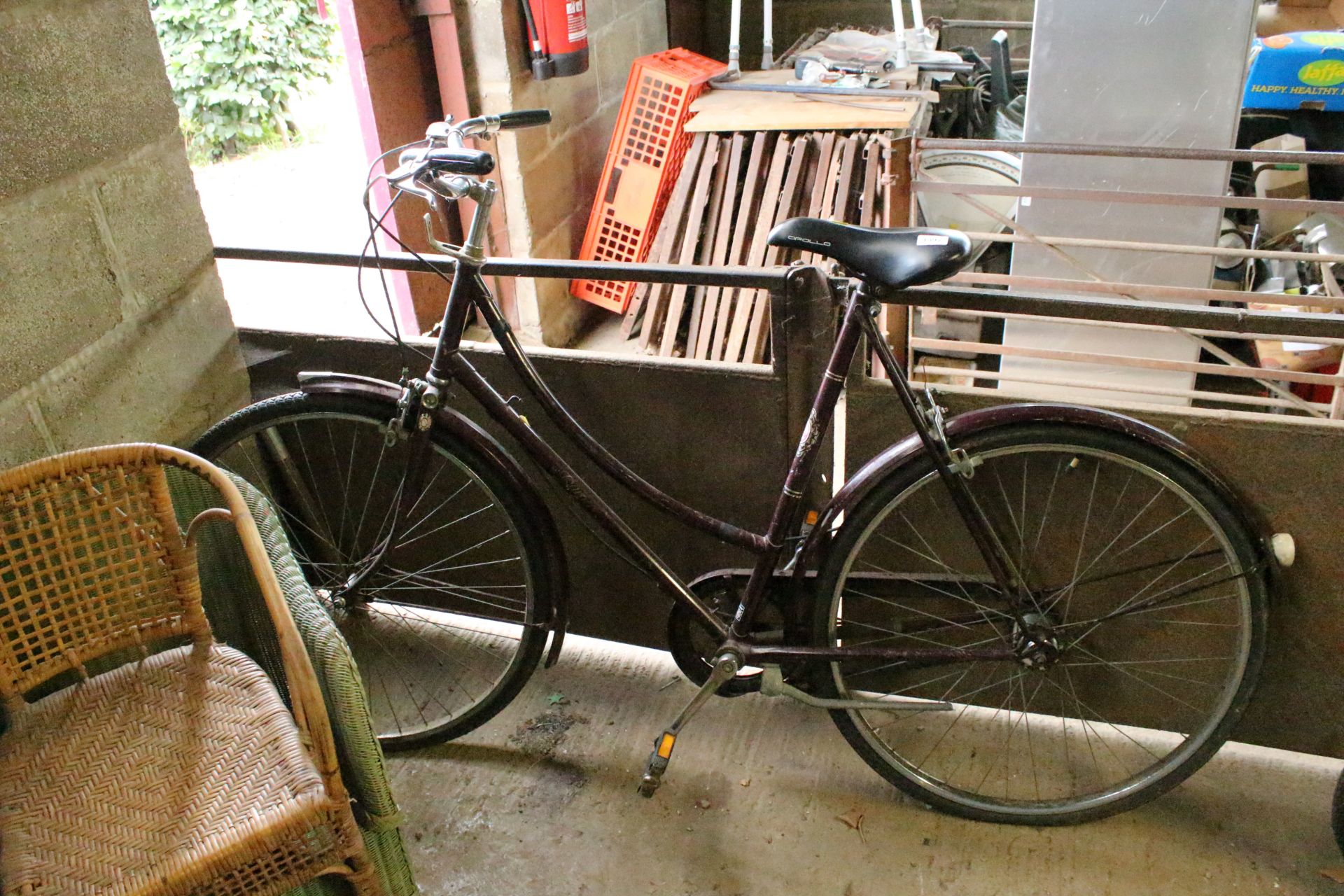 A ladies bicycle with front and rear mud guards