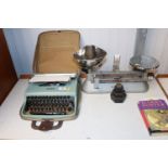 An Olivetti 22 typewriter and case and a set of sc